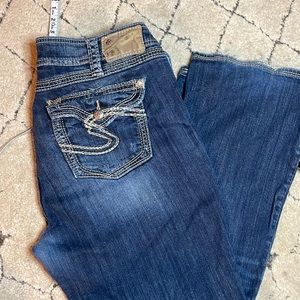 Size 16/32long silver suki surplus jeans with flap pocket distressed bootcut